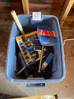 Overview of tote showing various tools, SnapTite container, wrench set, clamp