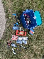 Entire lot laid out showing tote, tools, hardware packs