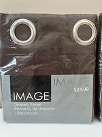 Front of packaged panel showing brand, size and grommets