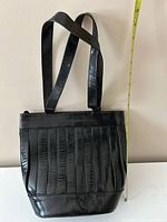 Front view showing vertical strip design and strap length