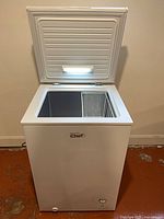 Lid open showing interior light, basket, and clean liner