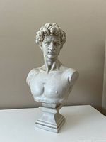 Front view of resin bust showing full torso and pedestal