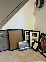 All seven frames grouped under staircase