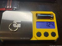 Ring on digital scale displaying 1.24 g
