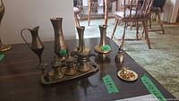 Group shot showing all brass items on table