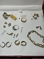 Overview of all costume jewelry pieces laid out in case
