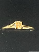 Front view of ring showing diamond and setting