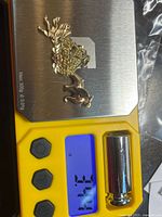 All three gold charms on scale showing 3.46 g