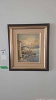 Full view of framed nautical oil painting on wall