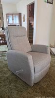Front angled view of light gray manual rocker-recliner