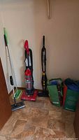 Group shot of vacuums, sweepers and bags