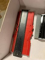 Red plastic contour gauge in box