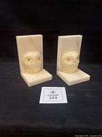 Front view of both owl bookends showing design and condition