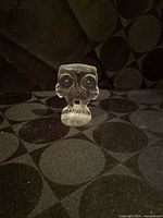 Front view of clear glass owl figurine standing upright