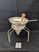 assembled Wear-Ever aluminum cone sieve with stand, pan, and pestle