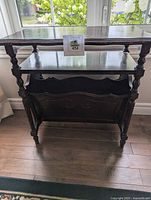 Front view of wooden side table with magazine rack