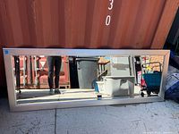 Front view of full-length mirror with silver frame