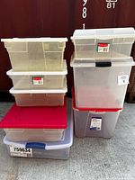 Full view of all stacked totes showing size variations and lids