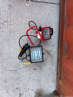 Both work lights laying on ground showing overall condition