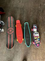 Top view of four skateboards side by side