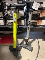 Front view of both pumps showing full height, brands, handles and gauges