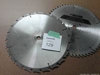 Two 10-inch circular saw blades showing tooth count and carbide tips