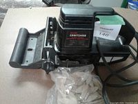 Overall view of Craftsman plate joiner and bag of biscuits