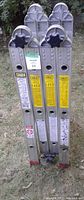 Ladder folded showing duty rating and instructions labels
