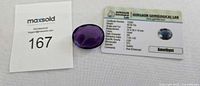Amethyst gemstone with lot tag and certificate card