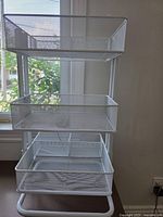 Front view showing three mesh baskets