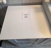 top view of white cabinet with MaxSold lot tag