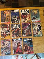 All 11 Marvel comics laid out, bagged and boarded