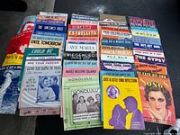 All thirty-eight sheet music pieces laid out showing covers and titles