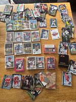 Overview of loose cards, unopened packs, various sports