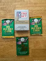 Front view of sealed inaugural boxed set and three 1991 packs