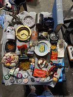 Overall view of entire tray showing all small collectible items