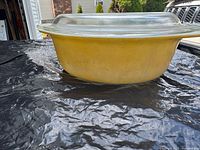 Side view of yellow Pyrex casserole with lid