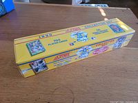 Sealed yellow box labeled 1990 Score Collector Set 704 player cards 56 Magic Motion trivia cards