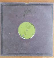 Front of die-cut jacket with vinyl partially exposed