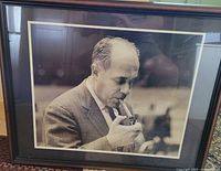 Overall view of framed Red Auerbach portrait
