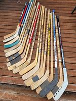 All 19 sticks laid out on deck showing shafts and blades