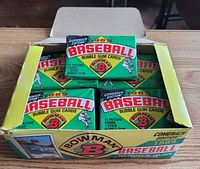 Open box showing multiple sealed Bowman packs