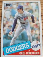 Front of 1985 Topps card showing Orel Hershiser pitching