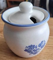 Jar with lid showing Yorktowne floral pattern and spoon slot