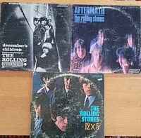 Front sleeves of three Rolling Stones LPs