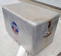 Front and side view of metal Hines Root Beer cooler showing logo, latch and wear