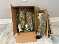 Box containing multiple bagged solar shrub lights