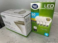 Sunco PAR38 LED 2-pack box beside Great Value LED 4-pack box