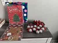 Group view of gift bags and assorted ornaments on tabletop