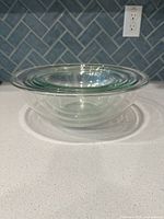 All five glass mixing bowls nested side view